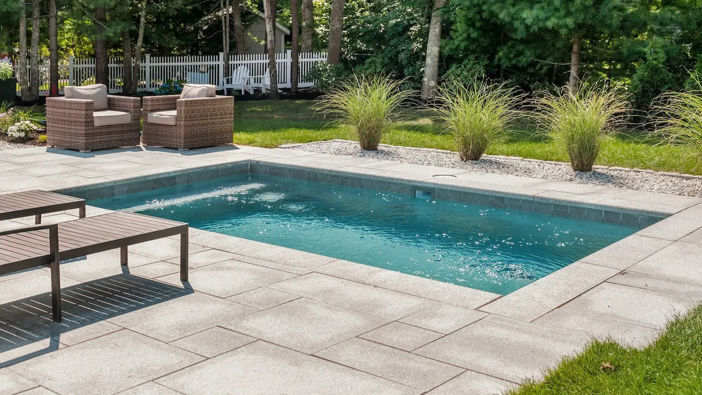 Custom backyard pool and patio build by Baur Pools